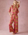 Women's pajama set featuring bright fuchsia leopard print shirt and wide-leg trousers - S / Rose