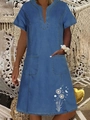 Detail of blue denim dress with V-neck, square pockets and white dandelion flower prints - Dark Blue Butterfly Dandelion Print
