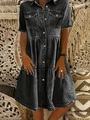 Detail view of washed dark grey denim dress with tiered skirt and button-up collar - S / Black