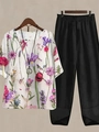 Detail of floral print linen top and wide-leg black trousers set for women - S / Top And Bottom / White and Black Painted Floral