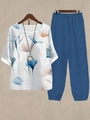 Flat lay of women's floral print top and dark blue trousers set with curved hem detail - S / Top And Bottom / Blue Orange Ink Floral (Style 38)