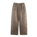 Detail of vintage brown wide-leg jeans featuring front seams and matching belted waist - Brown