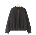 Close-up of black bomber jacket featuring ribbed collar and white size M neck label - S / Tops / Black