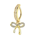 Macro detail of golden butterfly navel ring featuring sparkling inlaid zircon stones - Bowknot Style - Gold