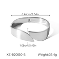 Detail of wide polished stainless steel bangle showing hinge closure and mirror finish - Xz-b20050-s