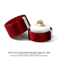 Red cylindrical velvet jewelry box for rings with white jagged edge and soft white interior - Rose Gold