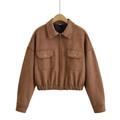 Detailed view of brown faux suede jacket featuring metal snap pockets and elastic hemline - XS / Dark Brown