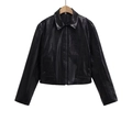 Detailed close-up of classic lapel and metal zipper on black faux leather PU jacket - XS / Black