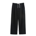 Detail der High-Waist-Hose mit weitem Bein, schwarz-weißem Kontrastbund und Kordelzug - XS / Schwarz