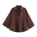 Close-up of a dark brown oversized linen shirt with wide batwing sleeves and buttons - Reddish Brown