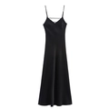 Detail of black satin midi dress featuring cross-strap V-neckline and sleek silk texture - Black