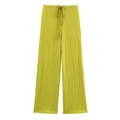 Detail of lime green wide-leg trousers featuring pleated texture and drawstring waist - Yellow-green Pants