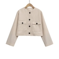 Detailed view of beige tweed jacket with large flap pockets and contrast black buttons - XS / Beige