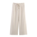 Dettaglio dei pantaloni larghi da donna con vita alta e coulisse regolabile in vita - XS / Beige