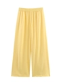 Detail of high waisted bright yellow wide leg trousers with elastic waist and flowing fabric - Yellow Pants