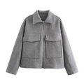 Detail of grey wool-blend jacket showing oversized flap pockets and silver zipper - Gray