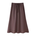Detail of high waist A-line maxi skirt with elastic drawstring and pleated texture - Dark Coffee