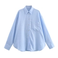 Dettaglio di camicia in lino azzurro che mostra il colletto a revers e la trama del tessuto - XS / Azzurro