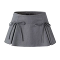 Close-up of a grey A-line mini skirt featuring decorative bows and pleated schoolgirl details - S / Gray