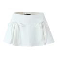 Detailed view of white high-waisted mini skirt with decorative bows and subtle pleats - S / White