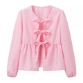 Close-up of pink long sleeve top showing front bow tie closures and ruffled hem detail - S / Pink