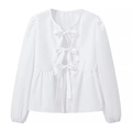 Detail of white long-sleeve blouse featuring three front bows and ruffled peplum hem - S / White