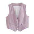 Detail view of a light purple V-neck vest with white buttons and faux pockets on white background - Purple