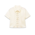 Cream short sleeve poplin shirt with ruffle trim and metal stud details on white background - S / Apricot