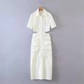 Detailed macro view of the white shirtdress showing cut-out waist and textured ruched fabric - XS / White