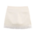 Close-up of cream satin mini skirt featuring delicate white floral lace hem stitching - Off White