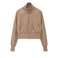 Macro detail of ribbed stand collar and texture on beige faux leather bomber jacket - Camel