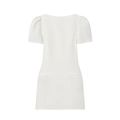 Detail of white puff sleeve mini dress featuring smooth fabric and decorative front pockets - XS / White