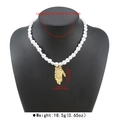 Detailed view of French vintage heart pearl necklace with golden Hamsa hand pendant - Heart Pearl Hamsa Hand Style (N13518) / Gold