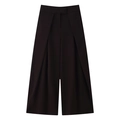 Detail showing the pleated waist and straight wide leg design of the black high-waisted trousers - Coffee