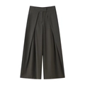 Detail view of dark grey high-waisted wide-leg trousers featuring elegant box pleats - Green