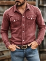 Detail of red-brown long sleeve work shirt with dual chest pockets and white buttons - Red