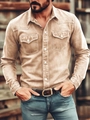 Detail of khaki denim shirt featuring western yoke, twin chest pockets and pearl buttons - Apricot