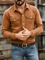 Close-up of brown long sleeve cotton shirt showing front chest pockets and white buttons - Camel