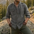 Detail of grey tactical shirt showing mandarin collar, epaulettes, and multi-pocket structure - Dark Gray