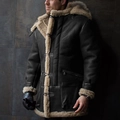 Detail of premium black faux shearling coat with textured suede and warm thick inner lining - S / Tops / Black