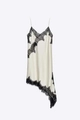 Detail of delicate black floral lace on a cream satin slip dress with irregular hem - XS / White