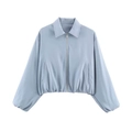 Detail view of light blue cropped jacket with silver zipper and elastic waist cuffs - S / Tops / Light Blue