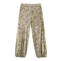 Detalle de los pantalones bombachos de terciopelo dorado con estampado floral - XS / Pantalones de Linterna