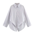 Detail of light blue striped long sleeve shirt with front buttons and curved hemline - Sky Blue Stripe