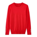Close-up of red crewneck knit sweater featuring elegant gold buttons on ribbed cuffs - S / Red