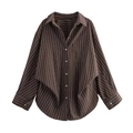 Detail view of brown vertical striped shirt featuring chest pocket and cuff buttons - Brown