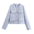 Macro shot of light blue tweed jacket texture and golden embossed buttons for women - XS / Light Blue