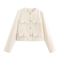 Detailed view of cream tweed jacket with four flap pockets and gold buttons - XS / White