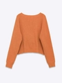 Close-up of caramel orange knit sweater showing thick texture and ribbed cuffs - S / Orange