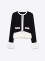 Detail of knit cardigan with elegant gold buttons and ruffled white contrast hem - S / Black